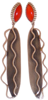 Navajo silversmith Michael Roanhorse created these coral dangle earrings. Navajo silversmith Michael Roanhorse created these coral dangle earrings.