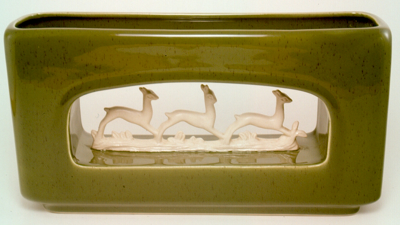 Howard Pierce's figures were sometimes incorporated into planters.