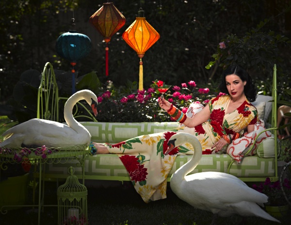 Von Teese in her backyard with her taxidermied swans. Photo by Douglas Friedman.