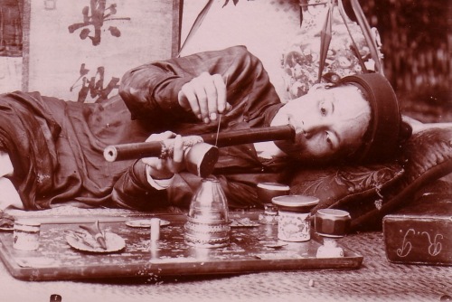 Top: Anti-opium propaganda poster from China, circa 1930. Above: This Vietnamese smoker's layout included a hardwood tray with mother-of-pearl inlay and miniature, spittoon-shaped pots on which to rest pipe-bowls.
