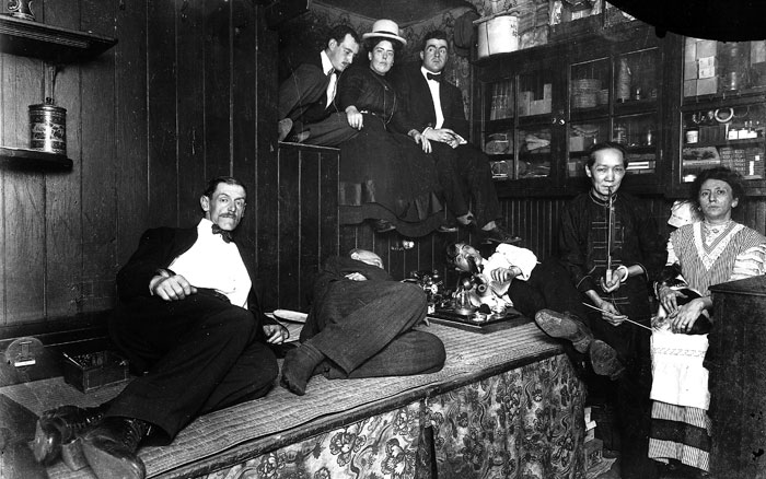 Americans smoke opium in a Chinese-run opium den in New York City in 1925.