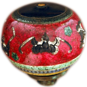 A rare pipe-bowl from the early 19th century adorned with red glaze and bats, both symbolic of happiness.