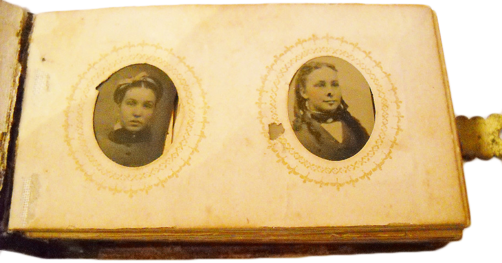 The family in this supposedly haunted 1880s tintype photo album is said to have burned to death in a fire.