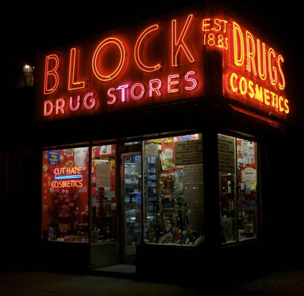 Block Drugstore in the East Village closes early, so its sign is rarely lit. Photo by Hively.