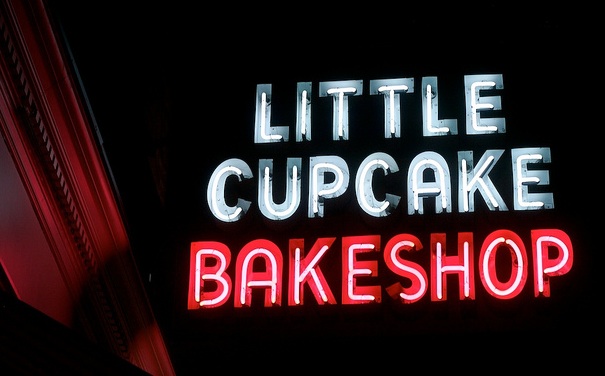 The sign at Little Cupcake Bakeshop, which just moved to a new location in SoHo, is an example of a small business putting up a new neon sign. Photo by Hively.