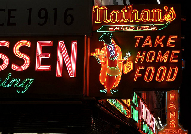 Nathan's Famous Hot Dogs chain has a particularly elaborate neon sign on the corner of Surf and Stillwell in Coney Island. Photo by Hively.