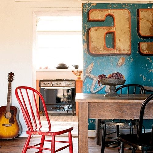 In 2008, hip design blog Apartment Therapy found inspiration in using a giant beat-up vintage sign as a rolling door. Credit: Marie Claire Maison via the style files.