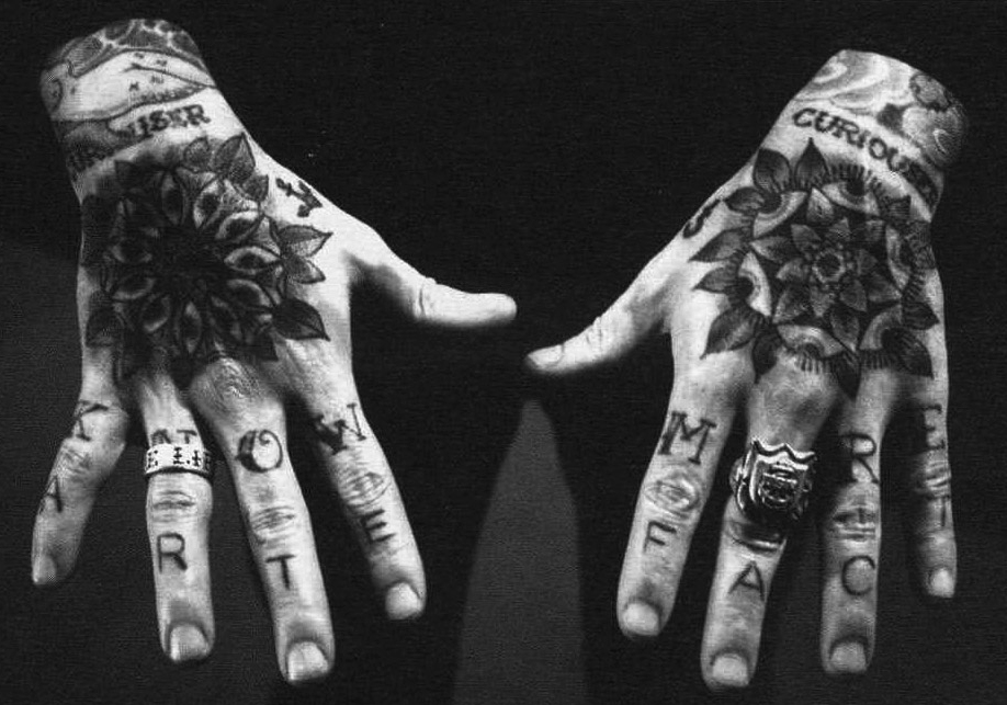 Matt Lodder's "Know More" hand tattoos blend naval superstition with academic sensibility.