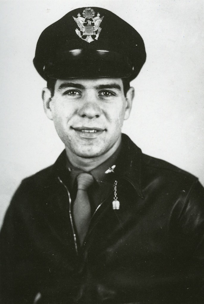 Capt. Sam Trave, of the 347th Fighter Group, wears a silver "Good Luck" bell from San Michele, Isle of Capri, attached to the collar hook on his unusually dark A-2 jacket.