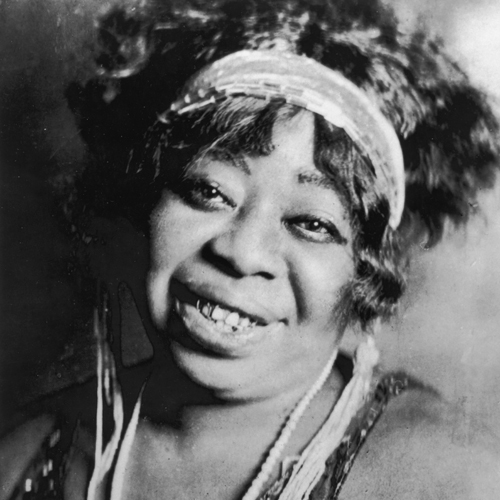 Top: Cabaret singer and pianist Gladys Bentley, who performed in a tuxedo, drew a crowd to the Clam House in Harlem in the 1920s. (Postcard image via QueerMusicHeritage.us) Above: Ma Rainey, "The Mother of the Blues," sang about pursuing women on a handful of tunes. (1917 image via WikiCommons)