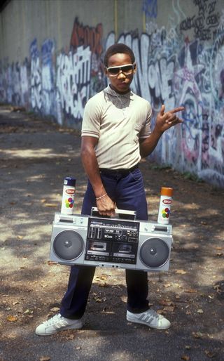 A young B-boy struts his stuff in New York, circa 1980. Photo by Martha Cooper.