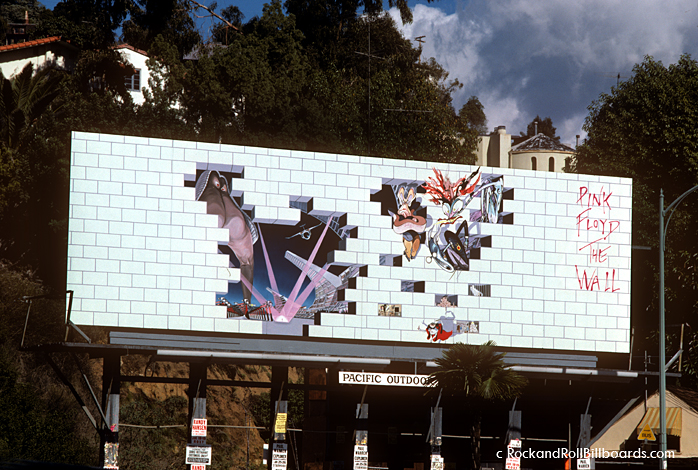 In 1980, the white bricks of this Pink Floyd billboard were slowly removed over a period of weeks to reveal the imagery underneath. Photo by Robert Landau.