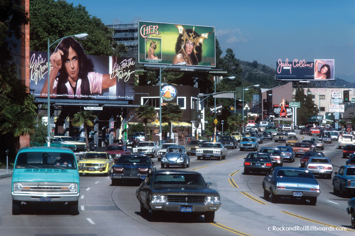 A view of Sunset in 1976, with hand-painted billboards for Eddie Money, Cher, and Judy Collins. Photo by Robert Landau.