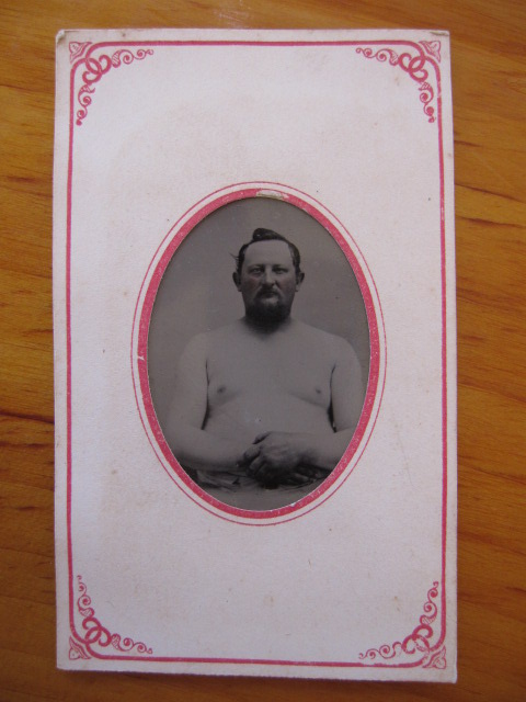 Why do you think this man is bare chested? - Photographs