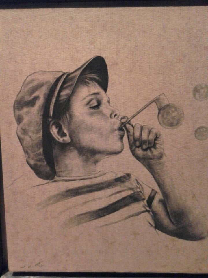 Boy blowing bubbles
