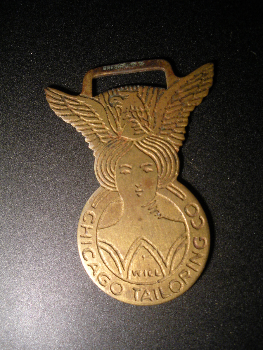 Chicago Tailoring Co. WATCH FOB With an Eagle spread wings above a bust of a woman. - Pocket Watches