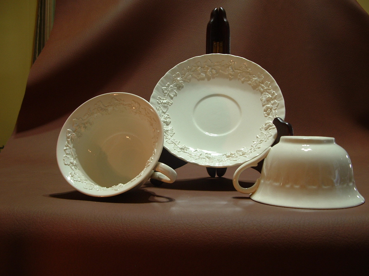 wedgewood embossed queensware  with pattern inside cups