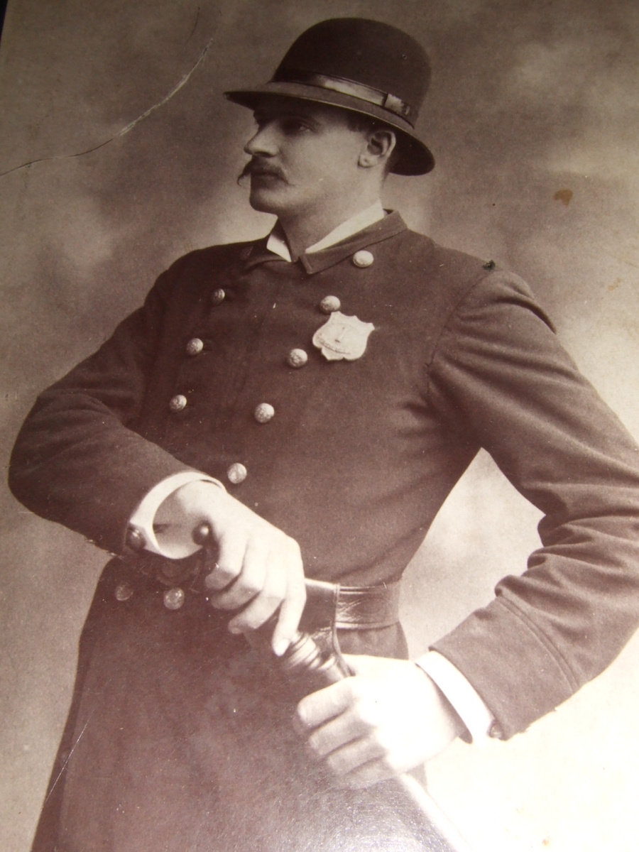 Cabinet card occupational of policeman with billy club and badge