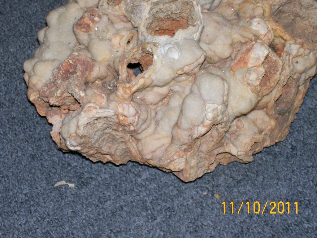 Unknown Old Rock with white glitter type growth on it ?