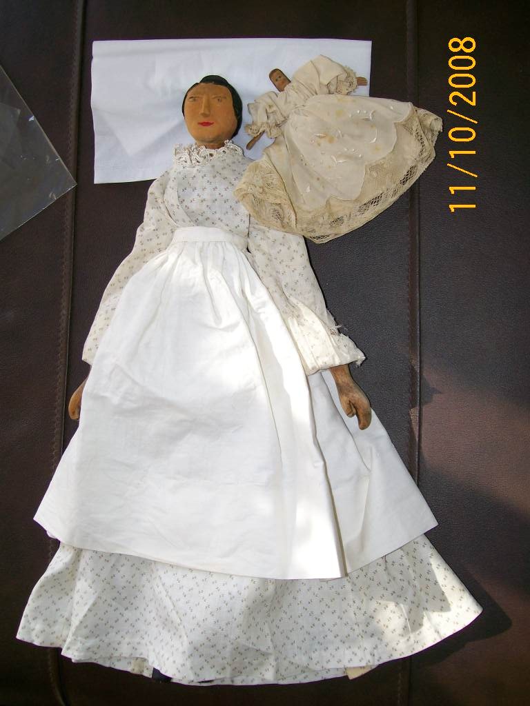Example of hand carved wood dolls circa 1800's to 1900 