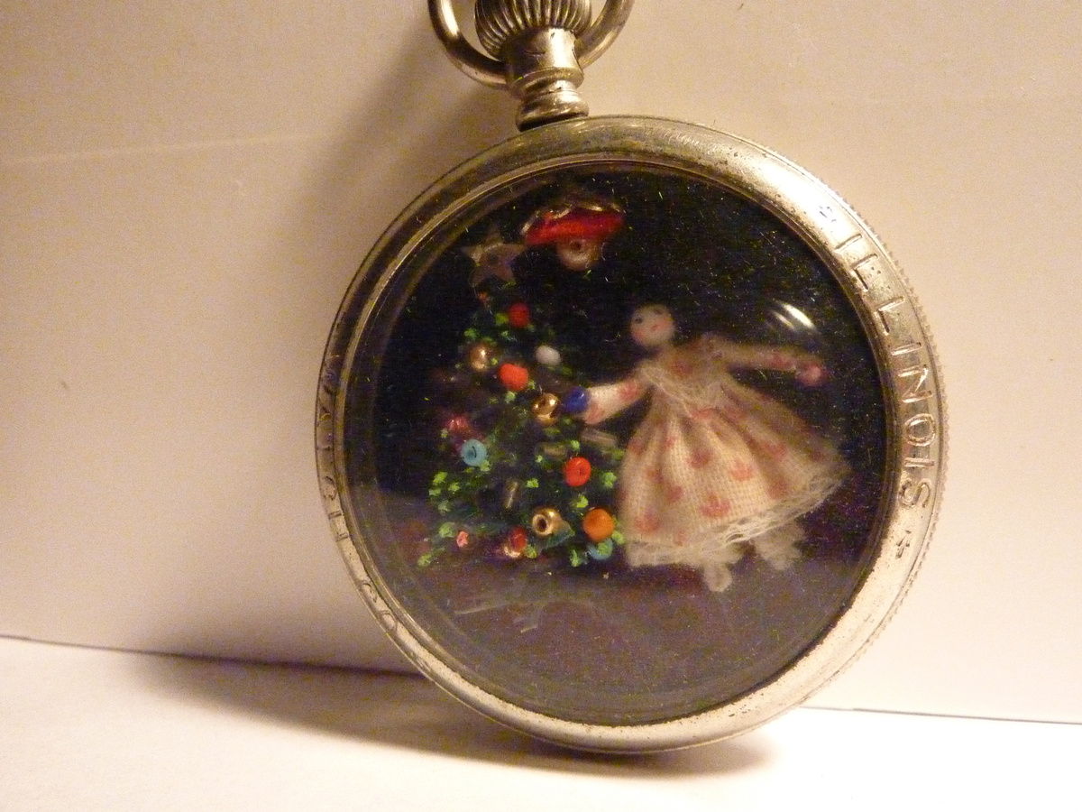 Doll inside Pocket Watch Case