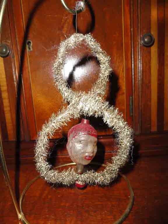 Double sided face of a man with negro features - Christmas