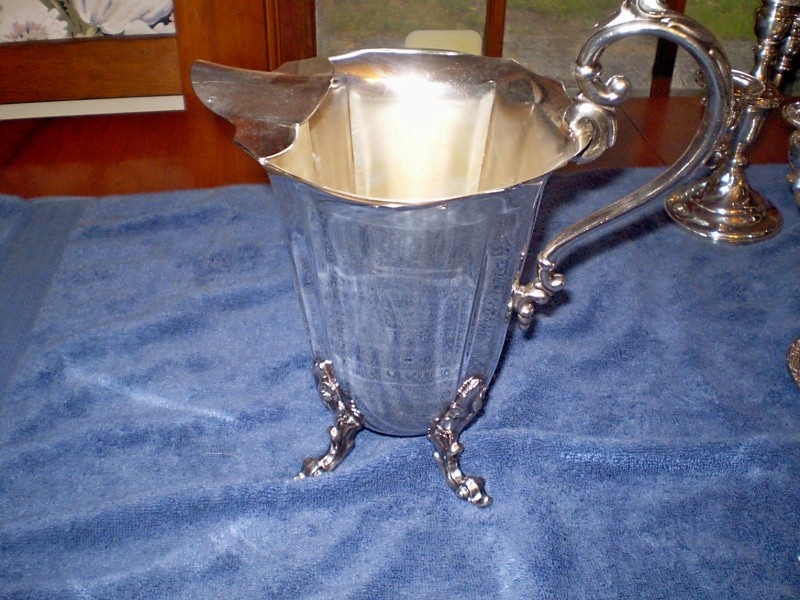 Mysterious pitcher with a crown (and nothing else) on the bottom