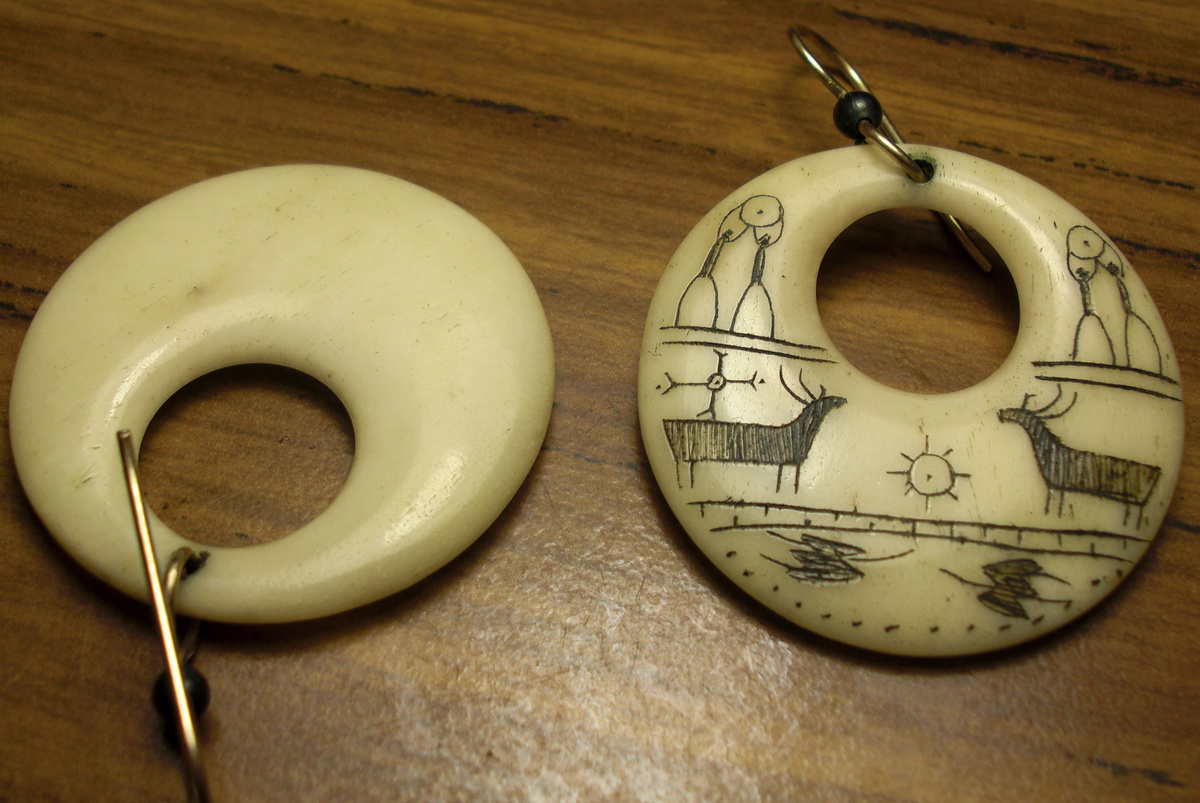Scrimshaw carved earings, Eskimo?