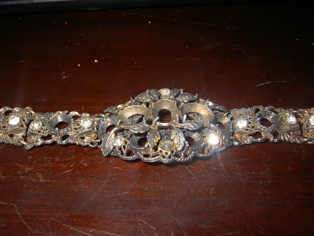 what can anyone tell me about this bracelet? I know the stones need to be replaced. Has anyone ever see this or know the age?