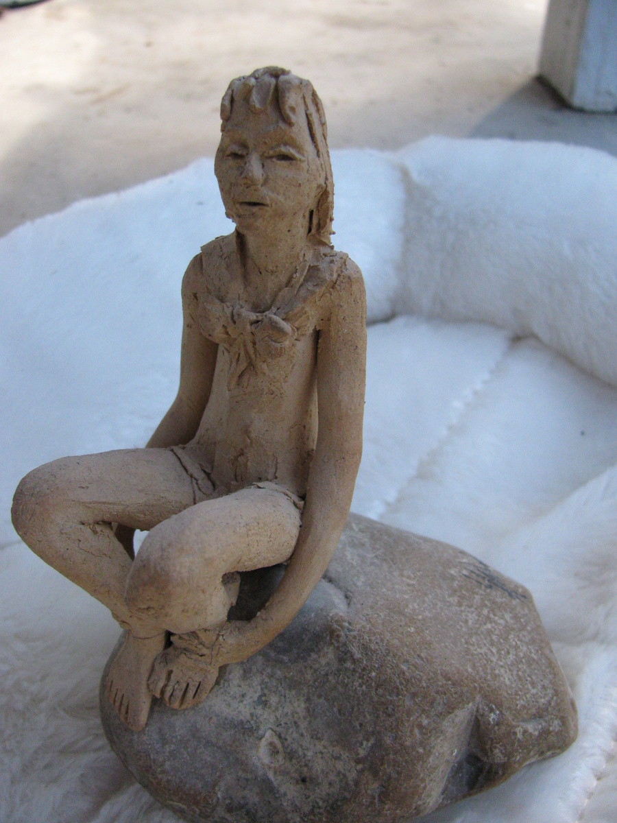 Girl on a rock - Art Pottery