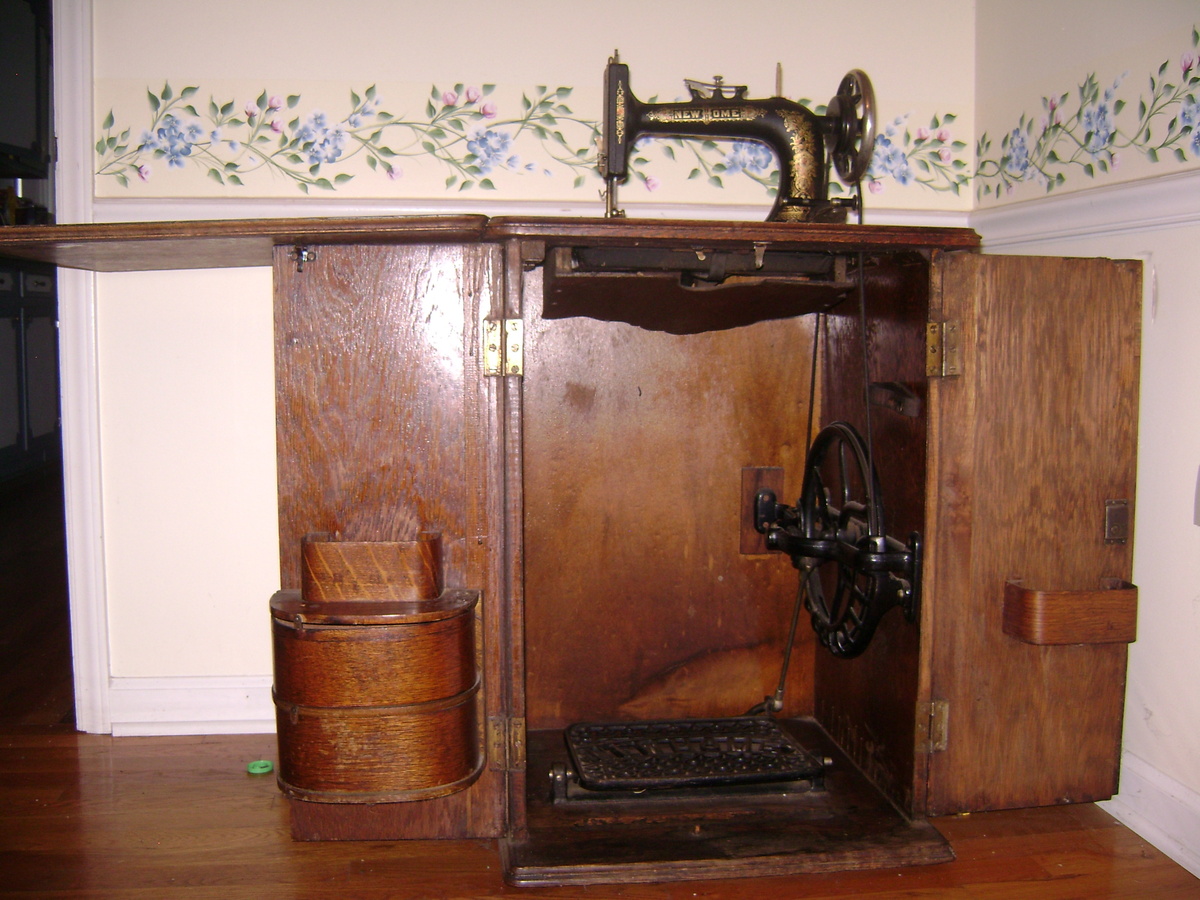 New Home Sewing Machine in Cabinet, circa late 1800s