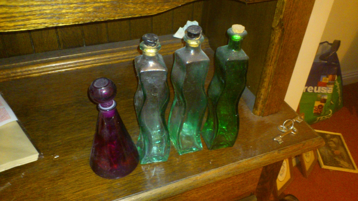 Four Vintage Chemist Bottles