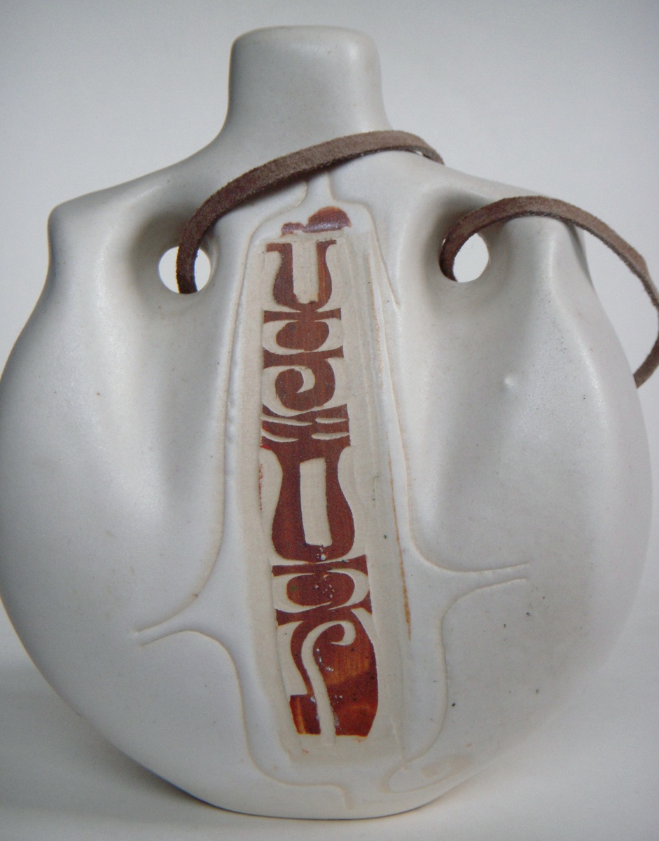 Carved Pottery hanging decanter/flask
