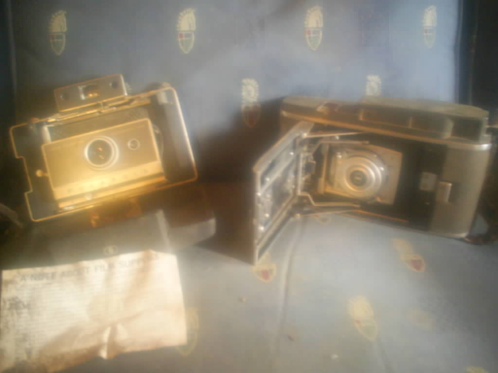 Old Polaroid and Kodak cameras