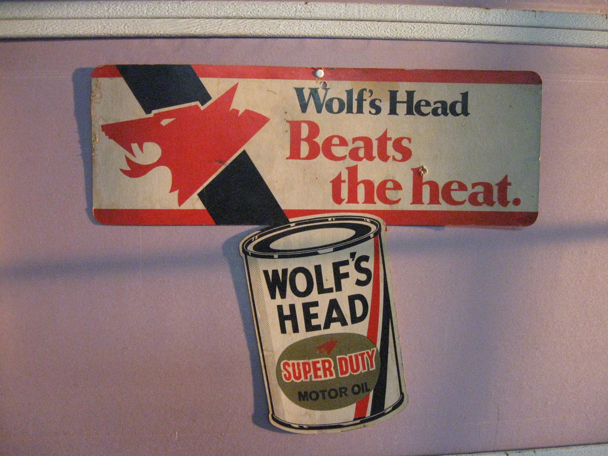 WOLF'S HEAD OIL CARDBOARD SIGN