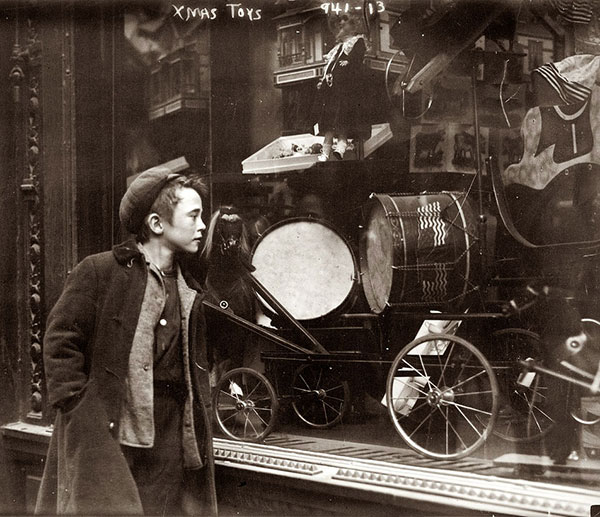 Young man looking out of train window on the historic steam engine